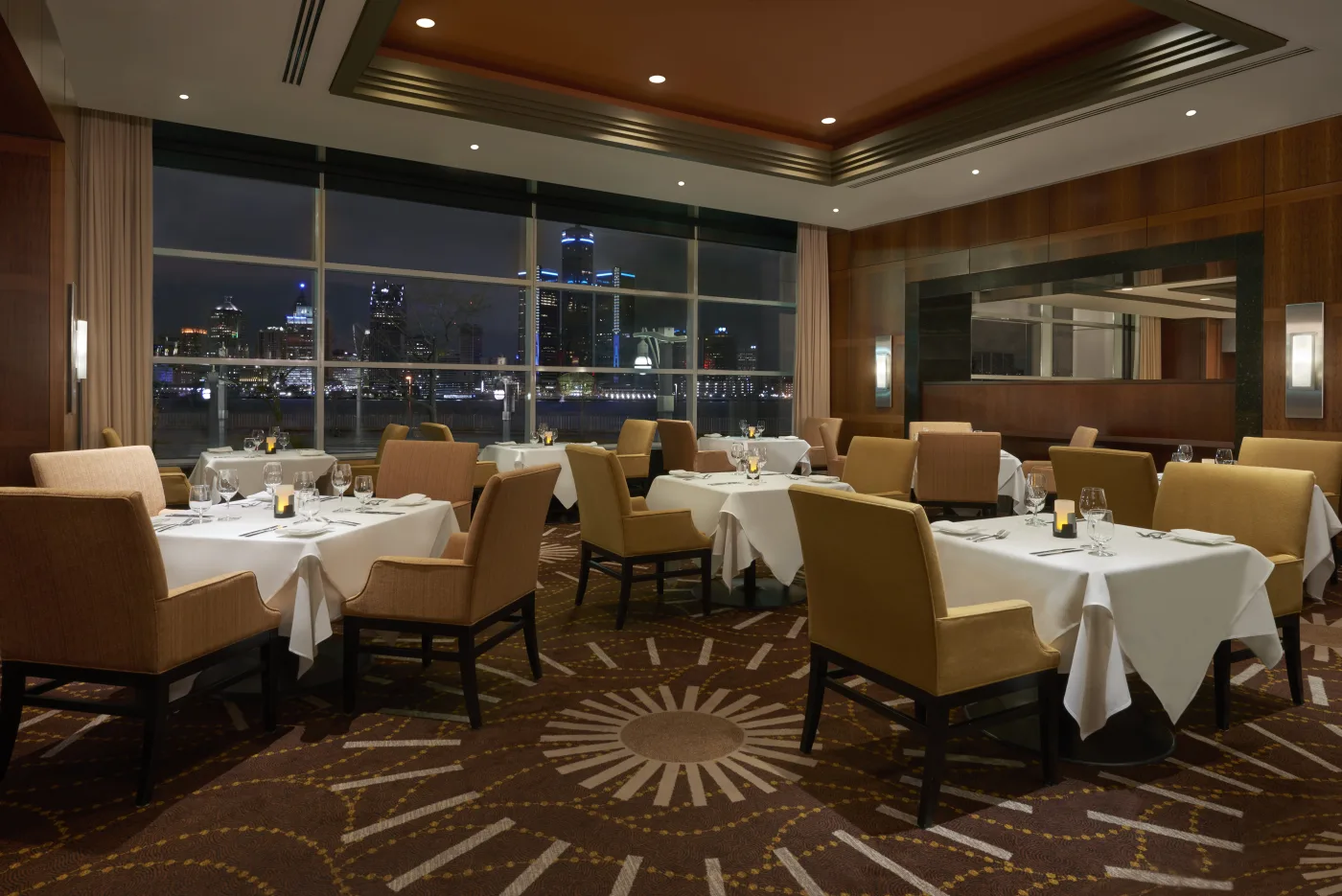 Warmly lit dining room at Neros Steakhouse